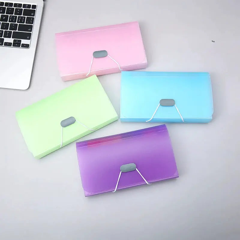 Simples Market A6 expanding file folders; 4-piece pastel set in pink, green, blue, purple with buckle closures