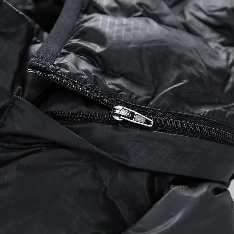 Men's black down jacket zipper close-up on ripstop nylon fabric