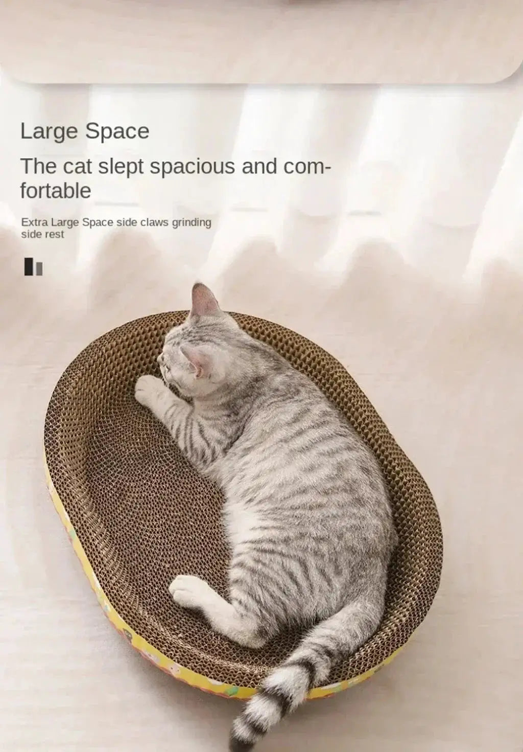 Cat scratching board in oval corrugated cardboard with a gray tabby cat resting on it