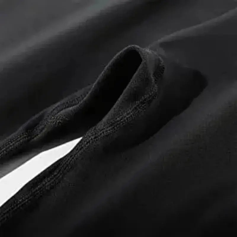 Seamless knitted leggings for women, black, high-waist athletic pants; close-up waistband texture