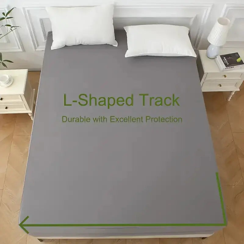 Gray mattress protector encasement on a bed with white pillows and nightstands