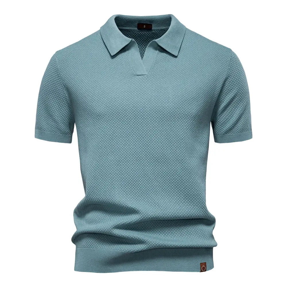 Men's golf polo shirt in light blue with textured knit fabric and short sleeves