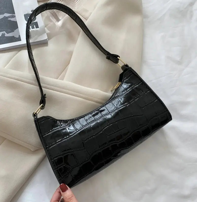 Small black crocodile-embossed PU leather handbag with gold hardware and short strap