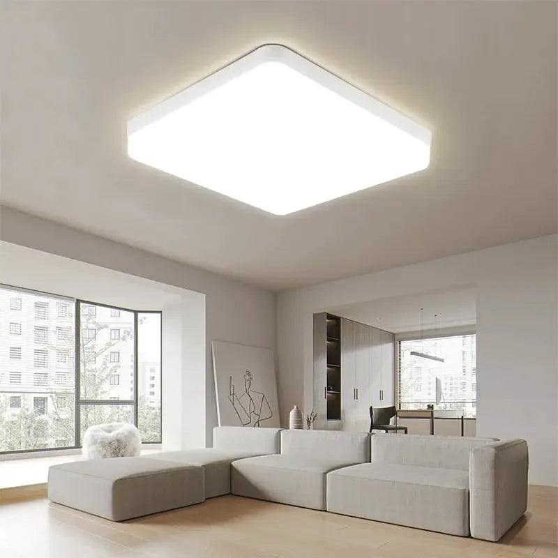 Square LED ceiling light panel in white finish, ideal for living room, bedroom, kitchen.