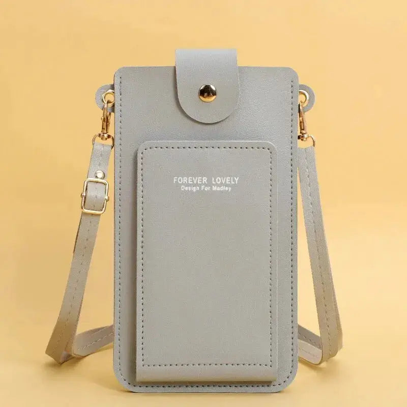 Grey soft-leather crossbody phone purse with front pocket and adjustable strap, Forever Lovely branding
