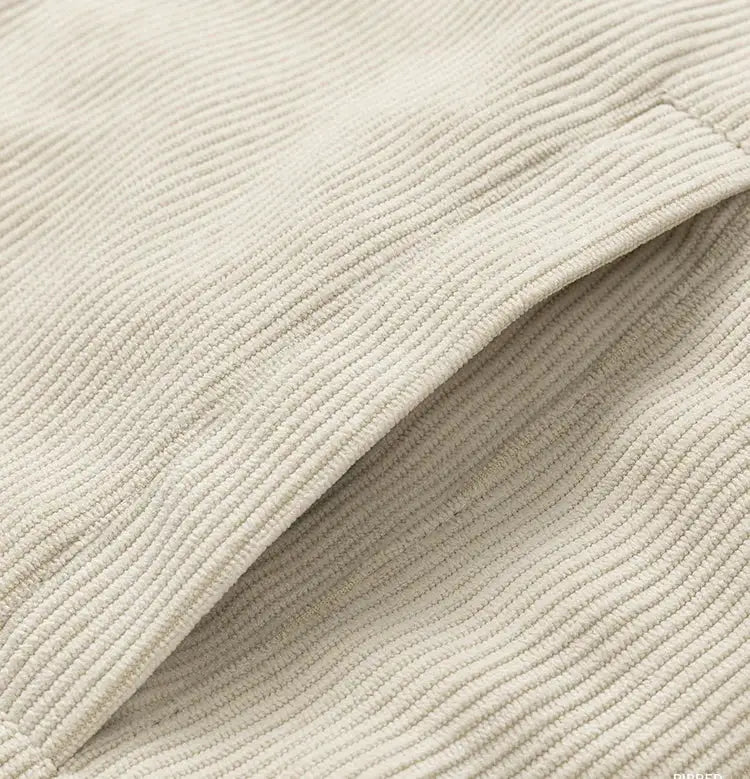 Men's beige corduroy coat fabric close-up; thick cotton texture, Simples Market