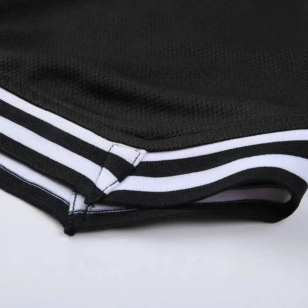 Men's basketball shorts in black with white side stripes; breathable mesh quick-dry fabric.