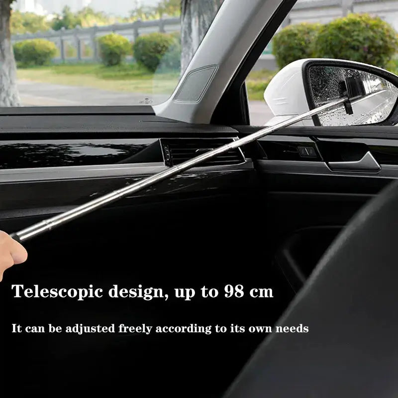 Telescopic car window cleaning brush with a long silver metal handle for windshield glass cleaning