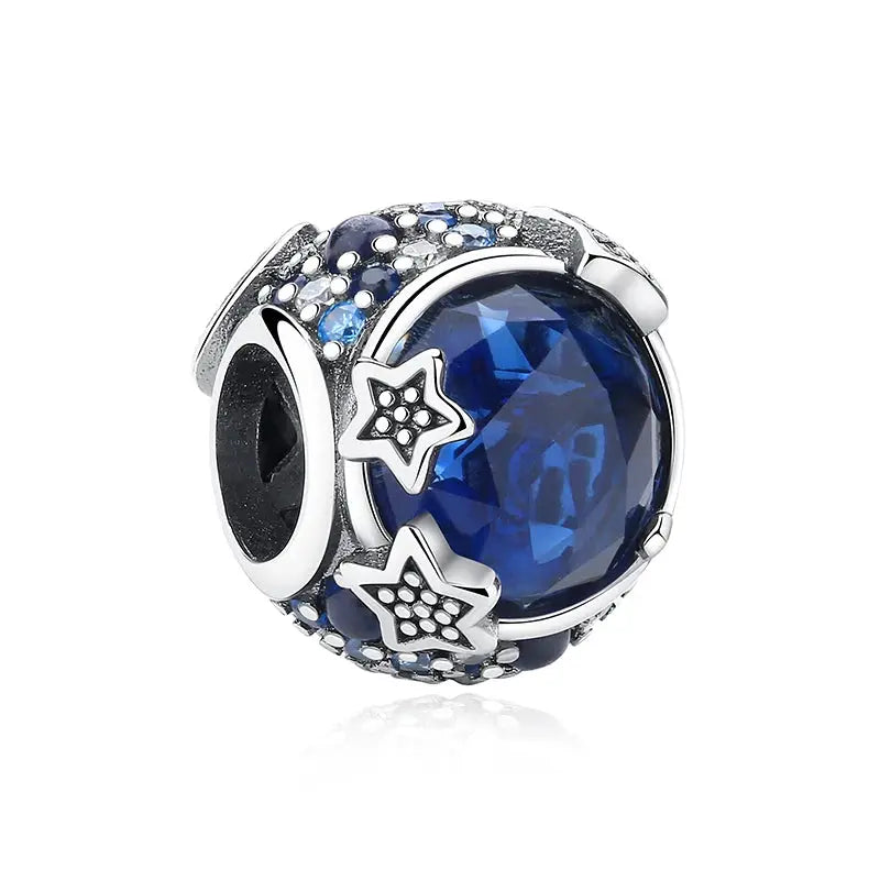 Sterling silver charm bead with a large blue zircon centerpiece and star accents for DIY bracelets