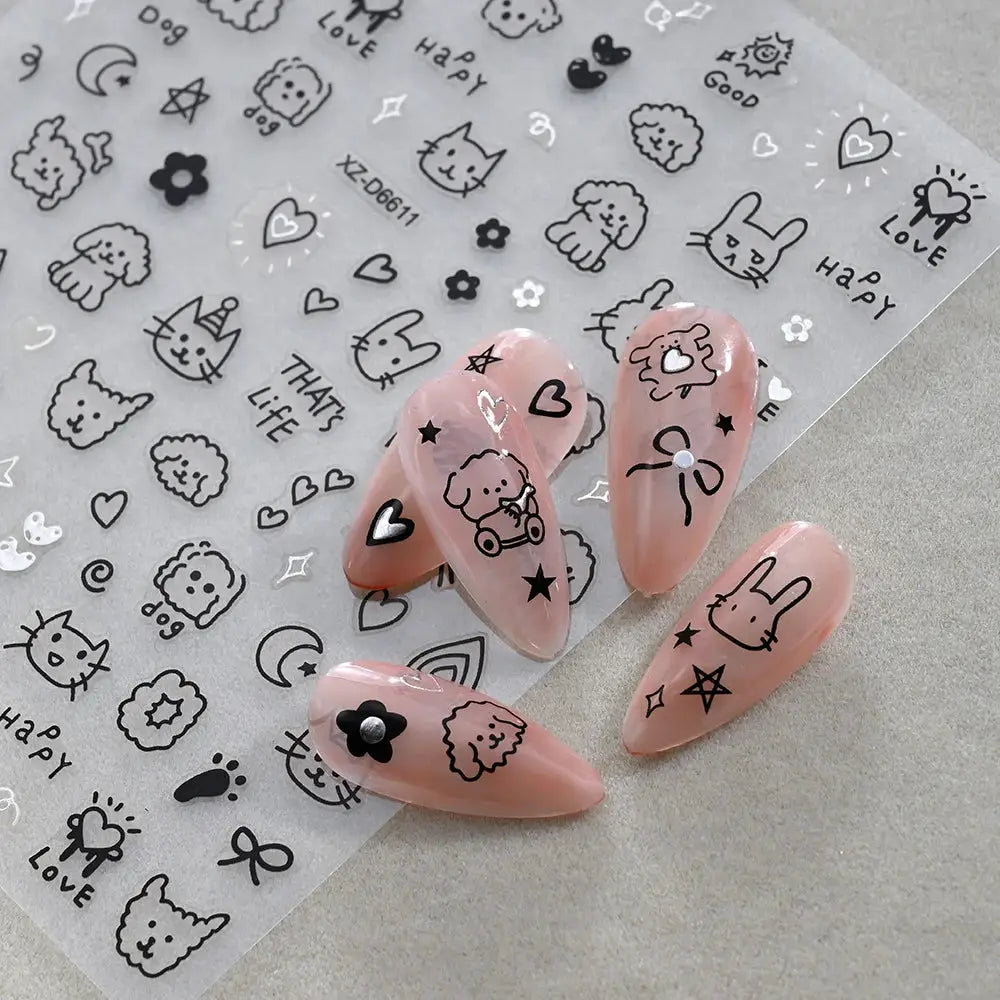 Nail sticker set: 12-sheet cartoon decals with black animal designs on clear sheets for kids' manicures