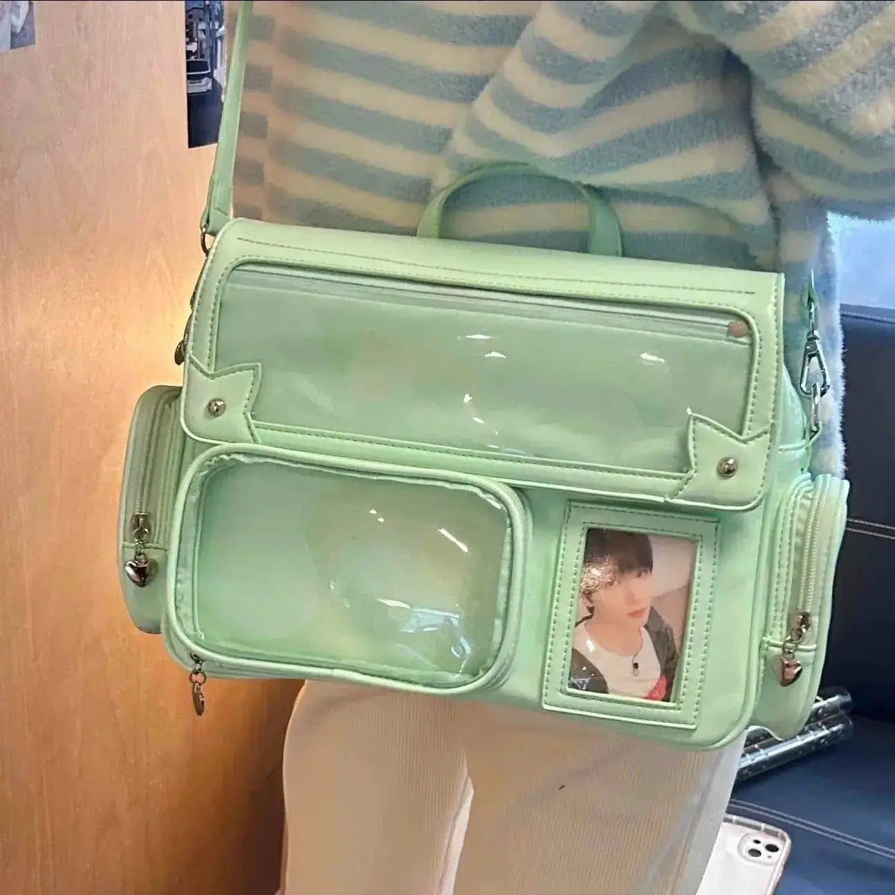 Pastel green ita bag backpack with clear vinyl panels and front photo window, Simples Market