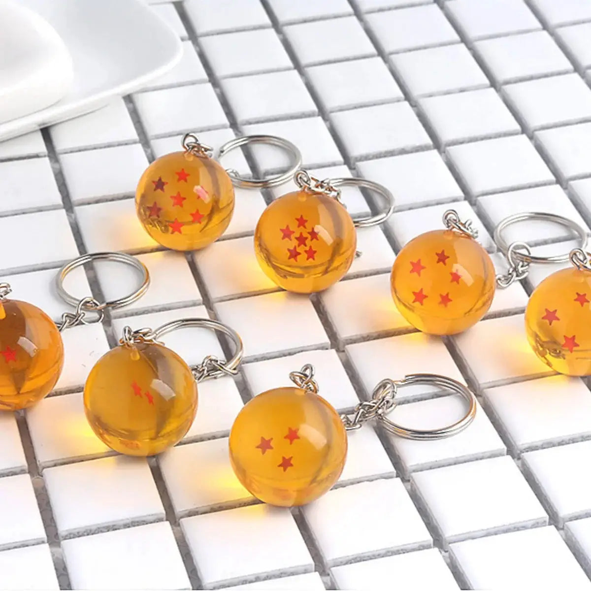 Dragon Ball bead keychains: 9 orange spheres with red stars on metal rings