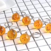 Dragon Ball bead keychains: 9 orange spheres with red stars on metal rings
