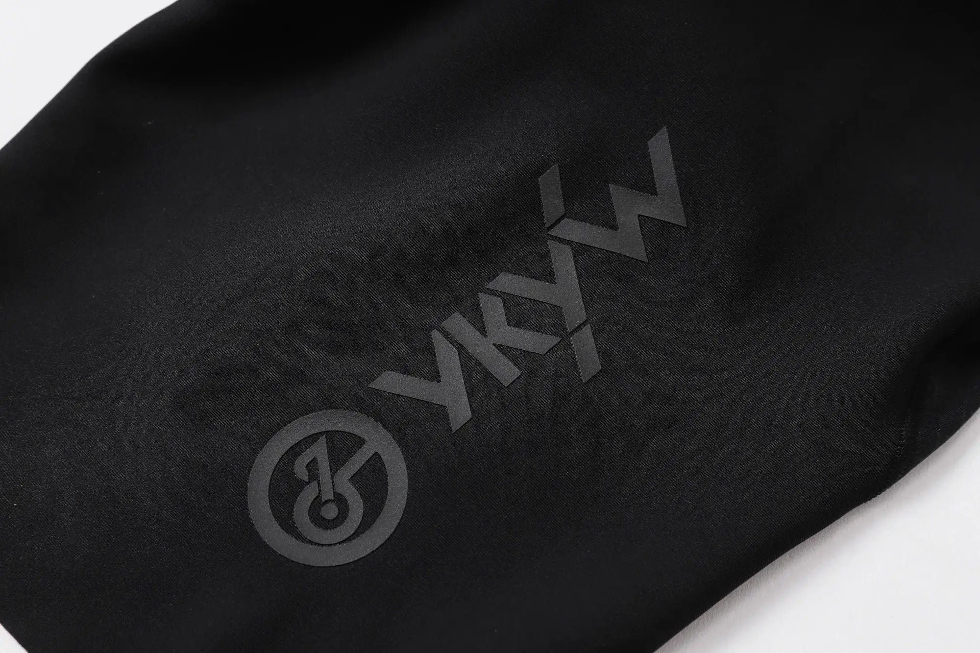 Cycling bib shorts in black fabric with subtle logo, Simples Market YKYWBIKE branding