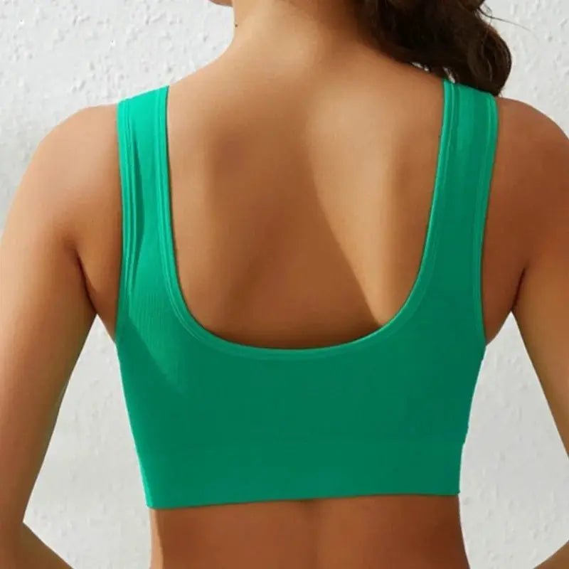 Green seamless women's wide-strap tank bra, wireless crop top with back scoop.