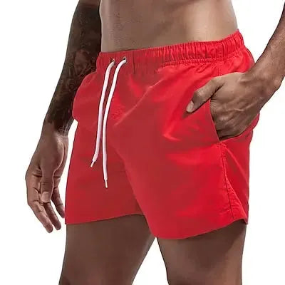 Simples Market red men's quick-dry swim trunks with white drawstrings and pockets.