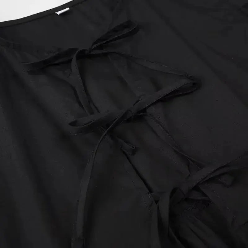 Blouse in black with tie-front, ruched detail and puff sleeves