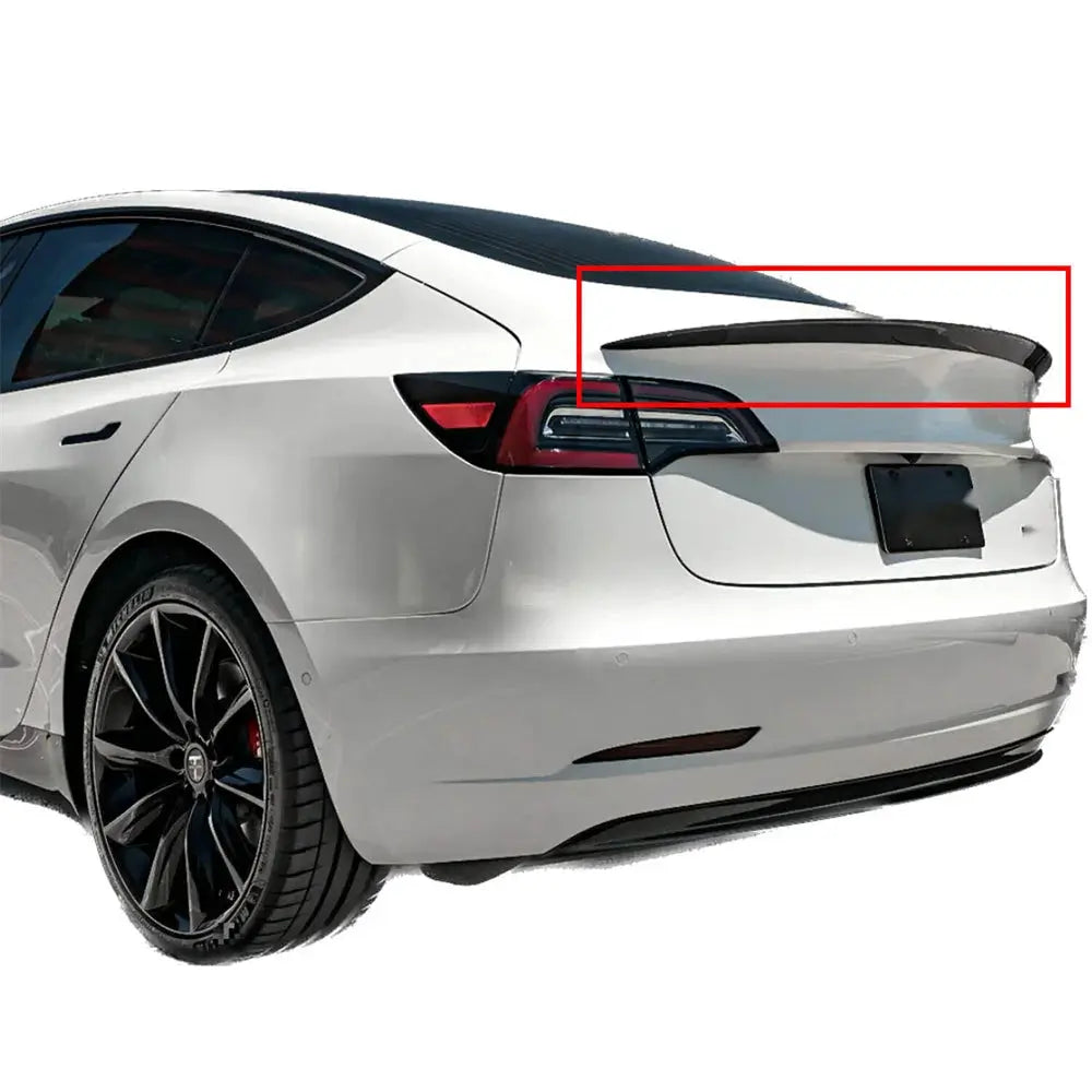 Rear spoiler for Tesla Model 3/Y; black gloss wing shown on a white sedan