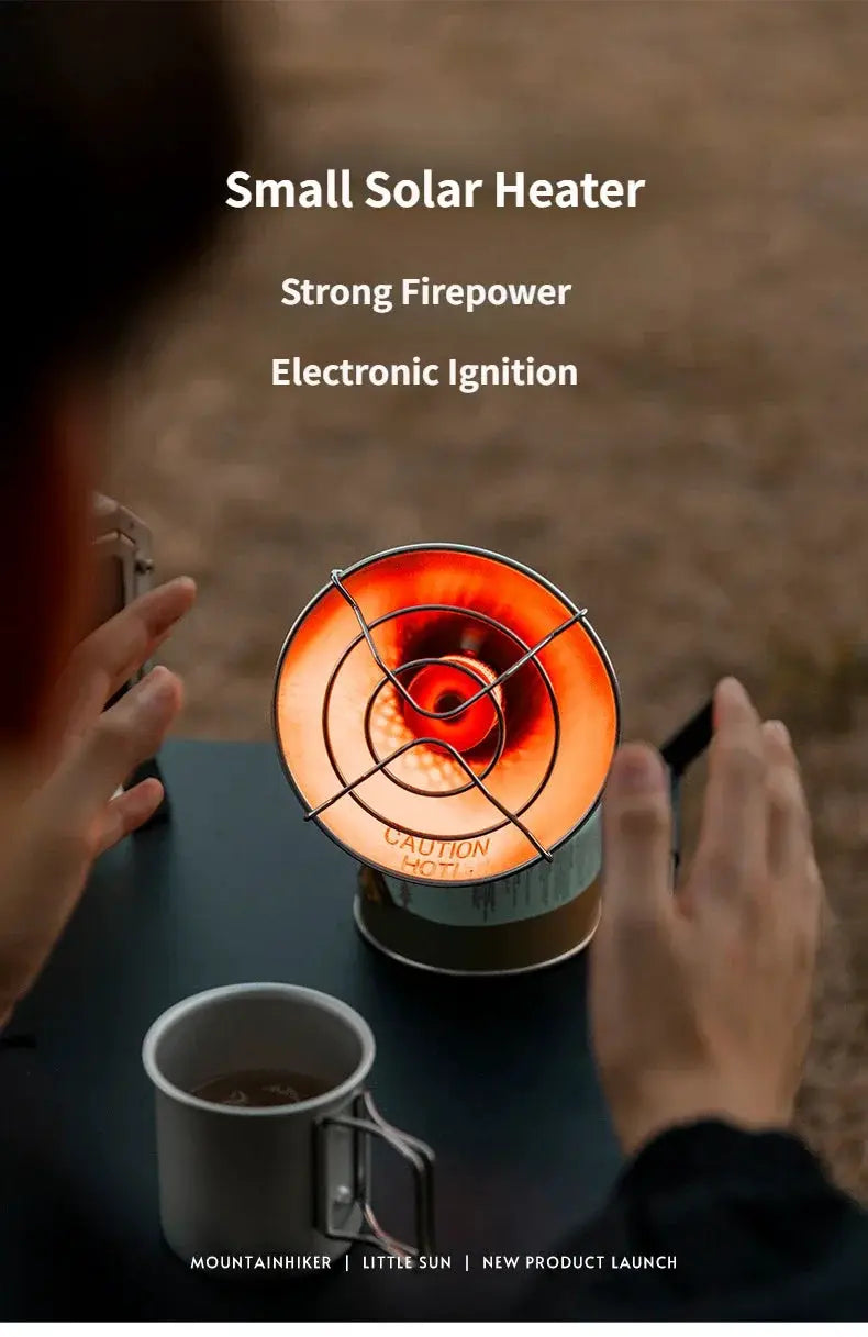 MountainHiker portable mini sun gas heater with orange glow on camping table beside mug