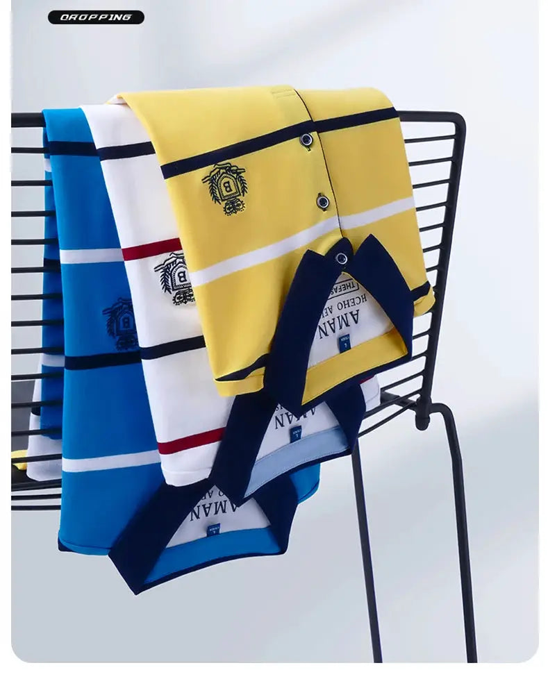 Three men's striped polo shirts in yellow, white/blue/red, and blue with crest embroidery; Gropping logo visible.