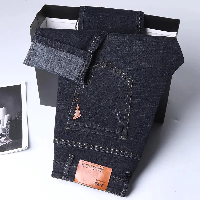 Men's straight denim jeans by Simples Market, dark indigo with back pocket stitching and leather patch