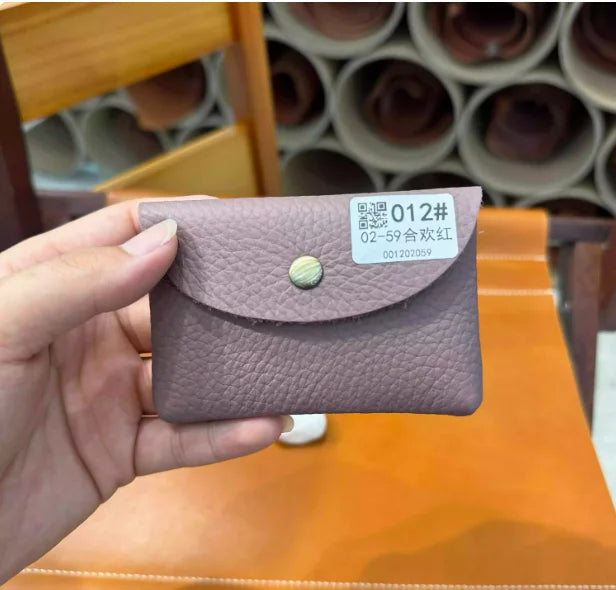 Genuine leather card holder in soft purple cowhide, mini envelope style with snap closure.