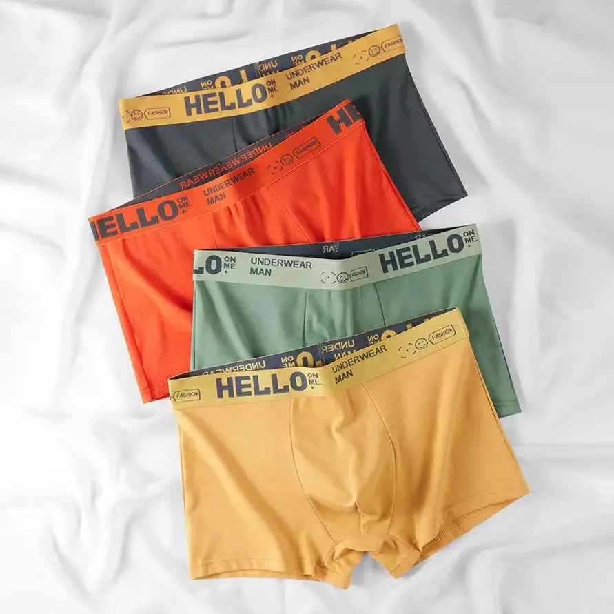 4-pack men's cotton boxer shorts with HELLO waistband in black, orange, green, and yellow.