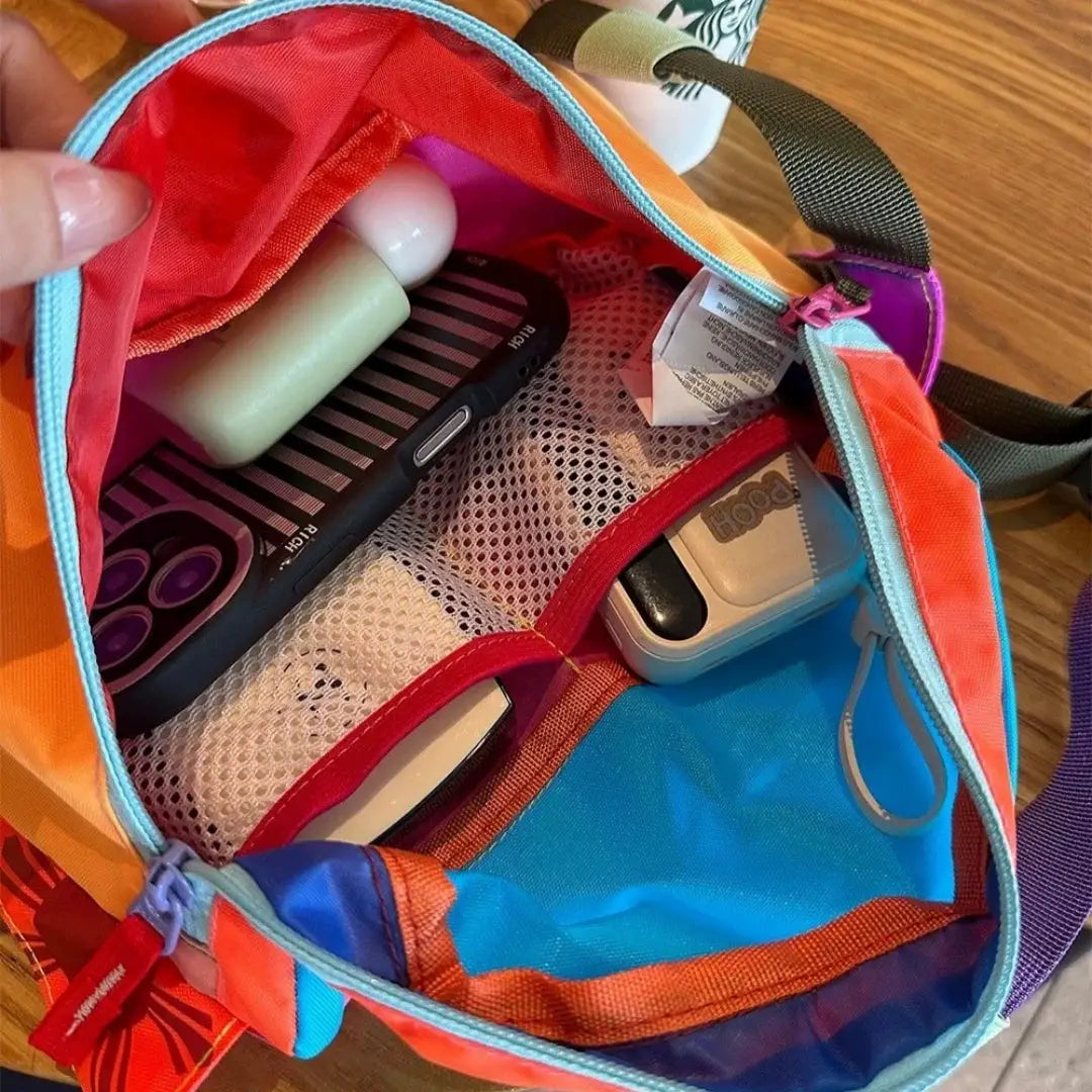 Waist bag, unisex, multicolor design with large capacity for hiking, opened to reveal toiletries and gadgets.