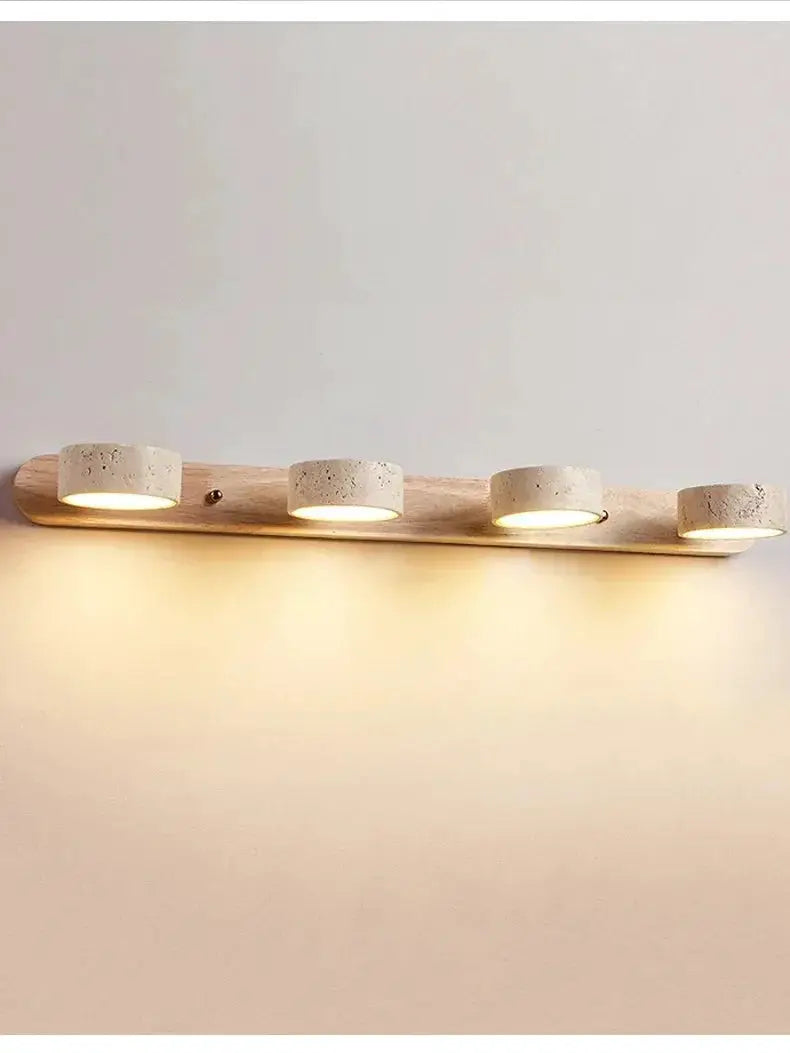 Japanese Wabi Sabi round LED wall light with four concrete cylinders on a wooden mount