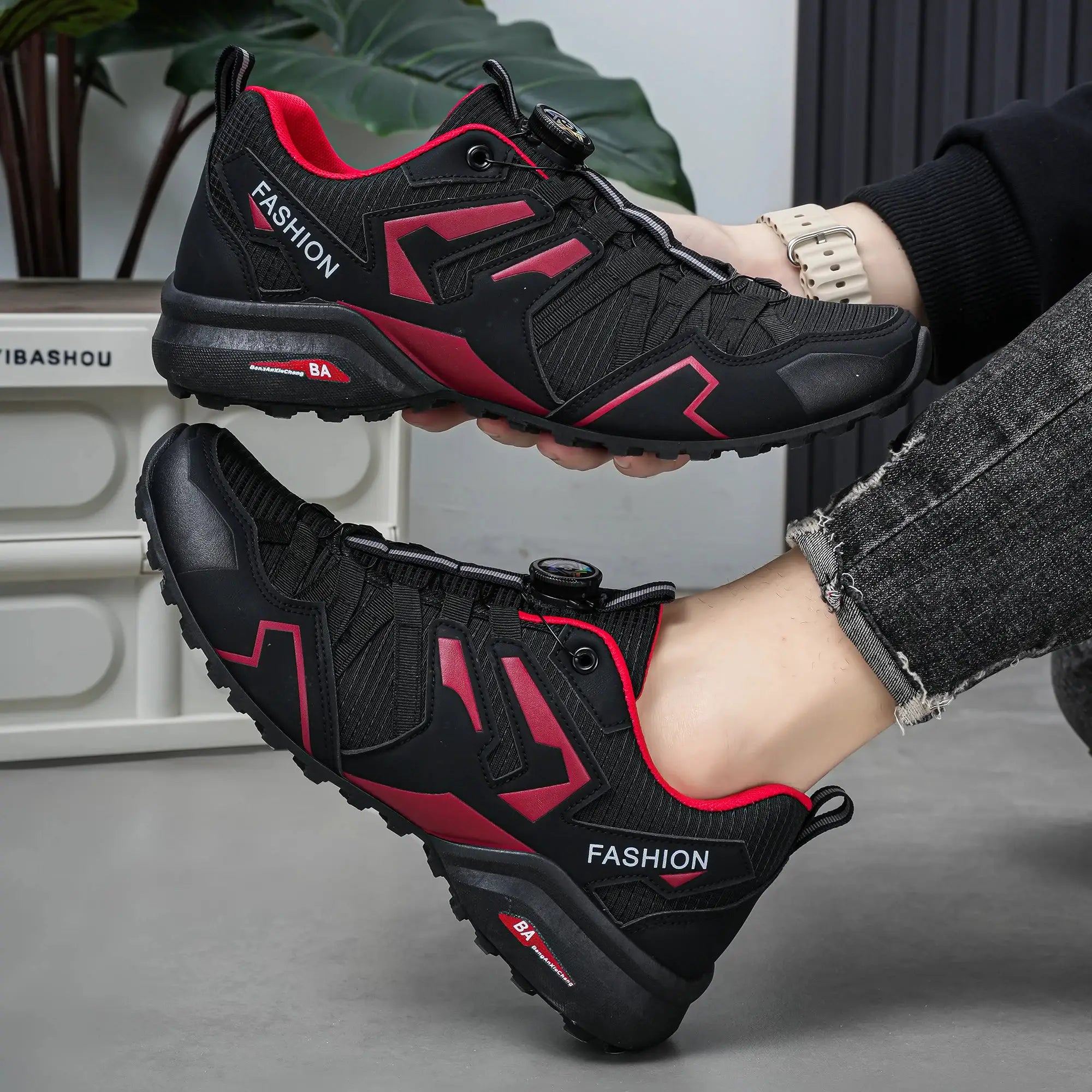 Pair of men's outdoor casual shoes, black with red accents and rugged outsole