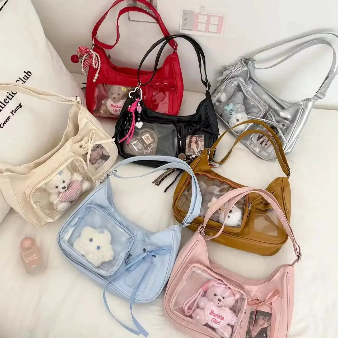 Y2k Harajuku transparent ita bags: 7 shoulder totes in red, black, silver, cream, blue, pink, tan with clear fronts.