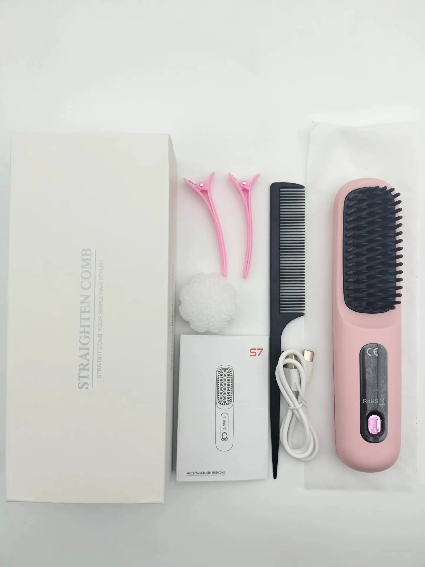 Pink cordless USB charging hair straightener brush with ceramic coating; includes two pink clips and a black comb.