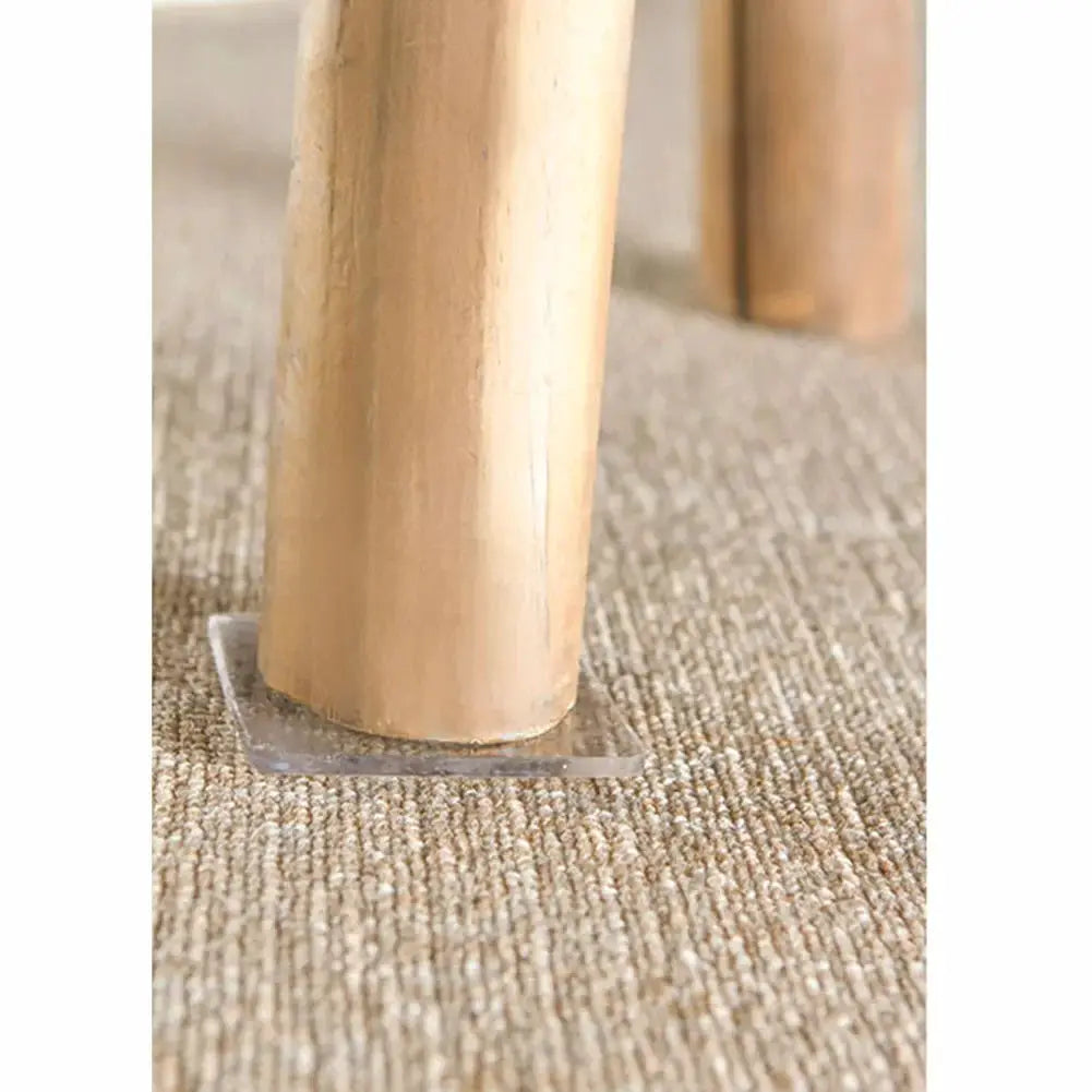 Simples Market 4-pack transparent anti-vibration non-slip silicone mats under a wooden furniture leg