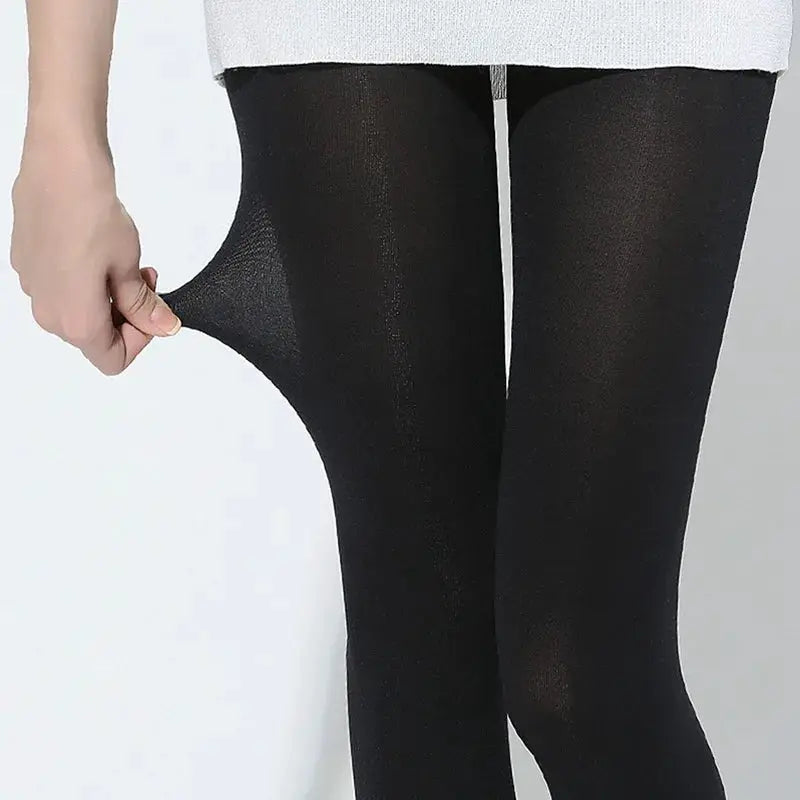Women’s seamless black tights, 80D nylon with stretchy opaque coverage.