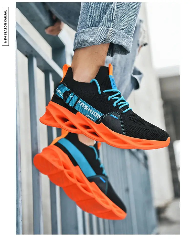 Sneakers by Simples Market; black mesh upper, bright orange thick sole, blue laces
