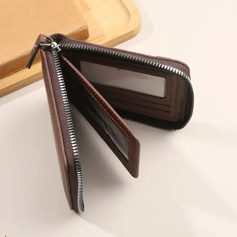 Men's brown leather zip-around wallet with card slots and clear ID window
