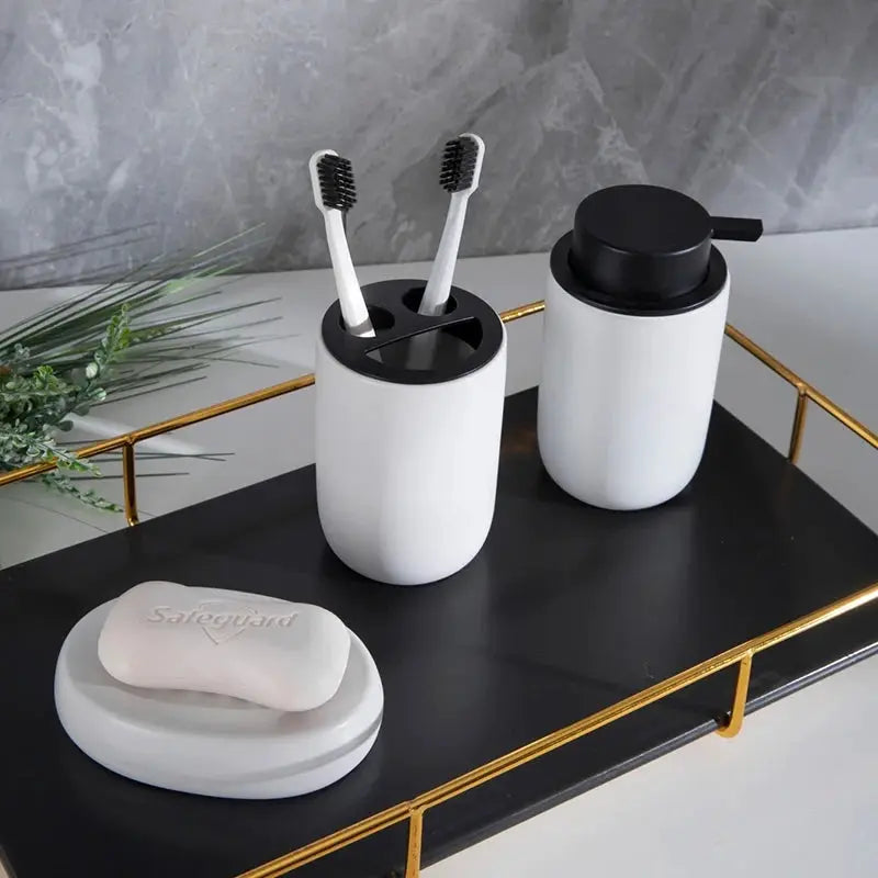 Simples Market ceramic bathroom set, four-piece white with black lids: toothbrush holder, mouthwash cup, sanitizer bottle, and Safeguard soap dish.