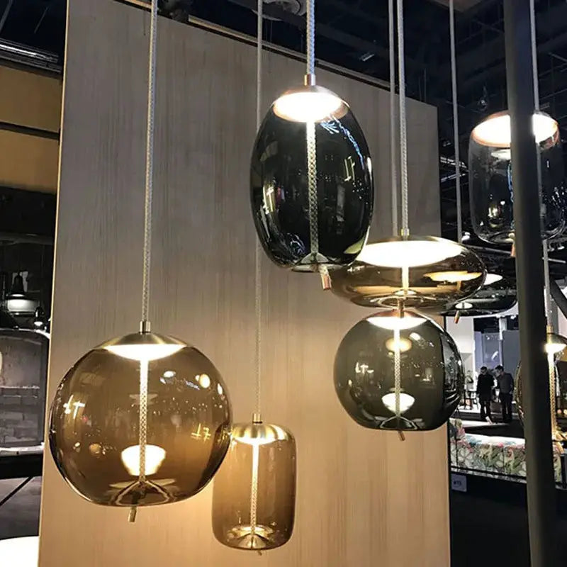 Minimalist pendant lights set of five with blue, amber and smoky glass shades and hemp rope suspensions by Simples Market