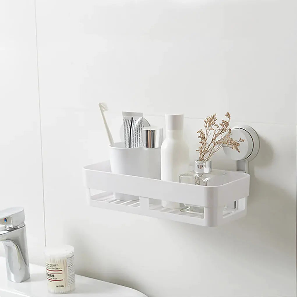 Shower suction-cup shelf basket, white plastic wall-mounted bathroom storage rack with draining slots.