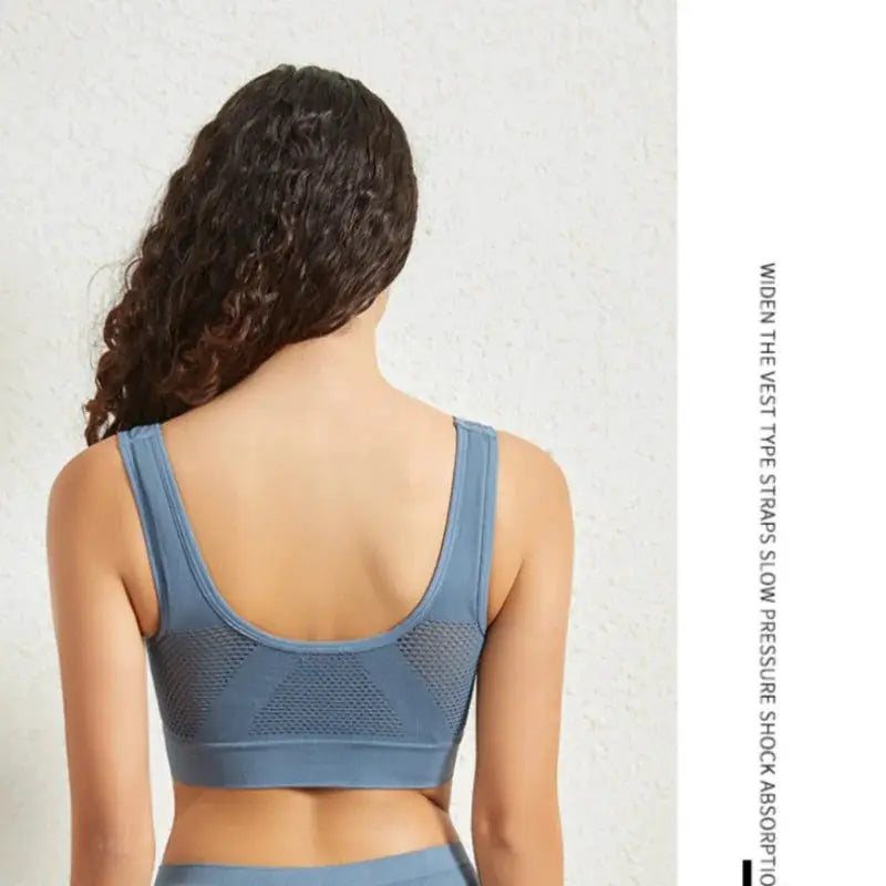 Women's plus-size blue breathable mesh sports bra with seamless back and wide straps