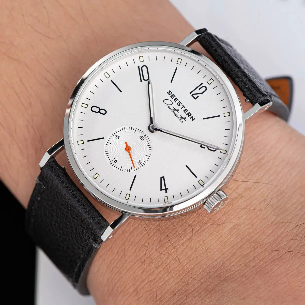SEESTERN automatic men's wristwatch; white dial, silver case, black leather strap, orange subdial hand