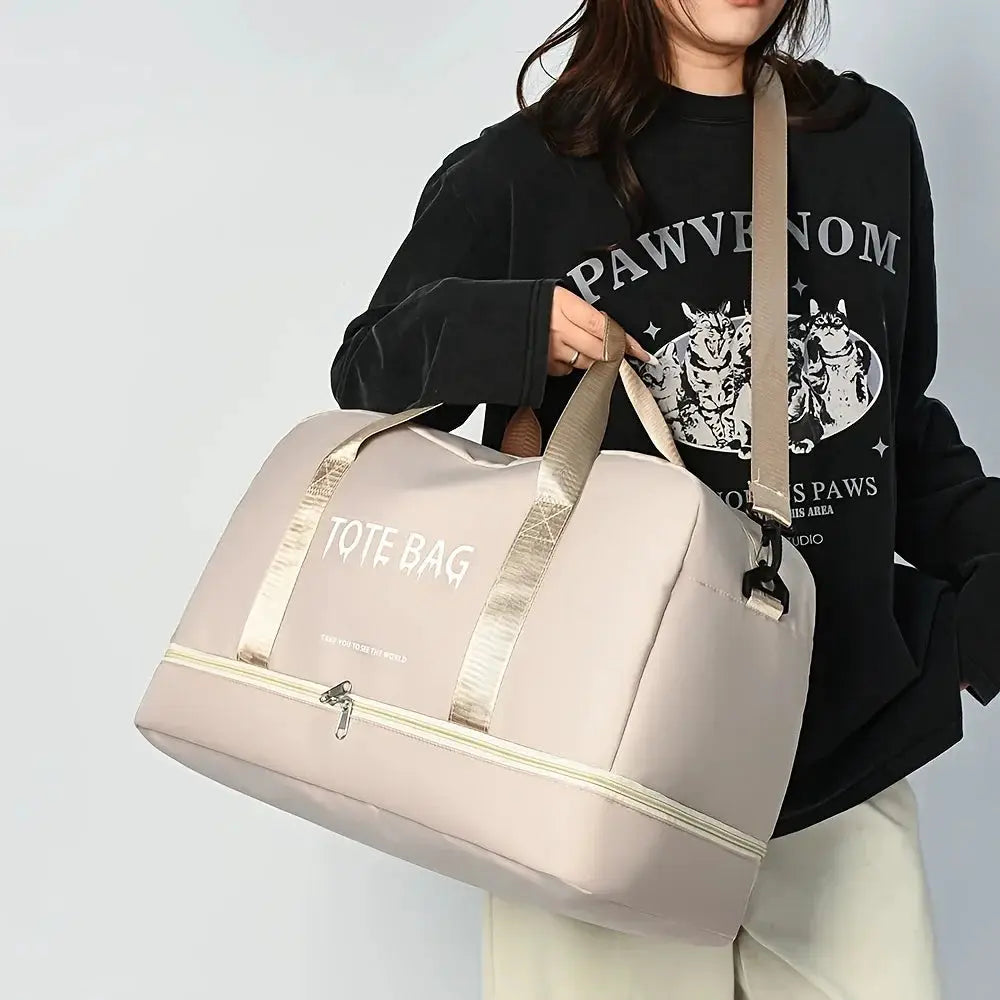 Large-capacity beige nylon travel duffle bag with dual top handles and removable shoulder strap, front TOTE BAG text.