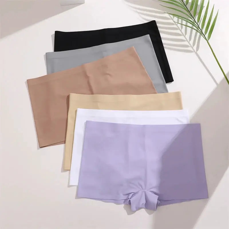 Six seamless women's panties in solid colors: lavender, white, beige, taupe, gray, black.