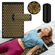 Simples Market acupressure yoga mat with gold spike studs and Kuznetsov’s applicator cushion with bolster