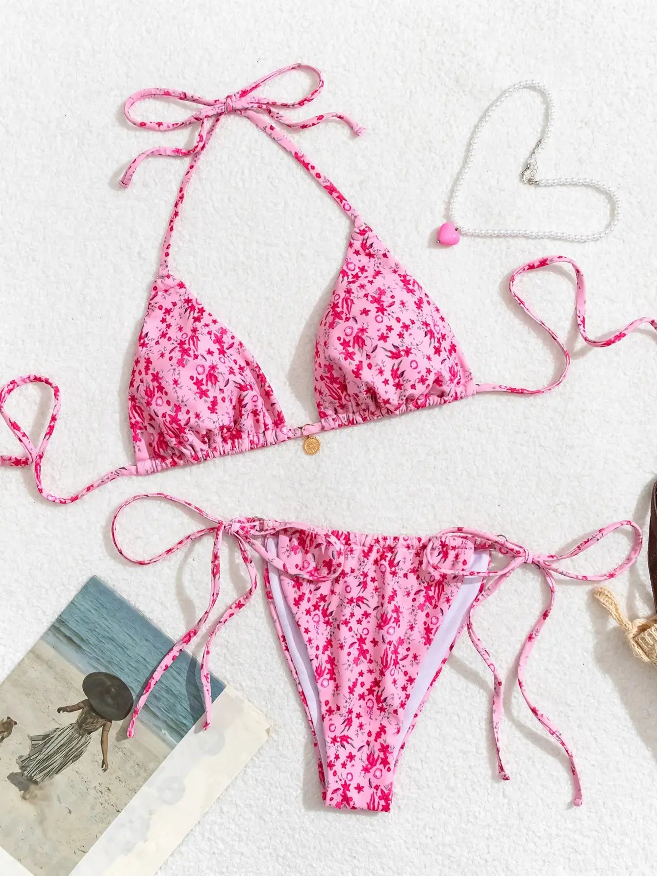 Women's pink floral two-piece bikini set with adjustable tie-side top and side-tie bottom by Simples Market