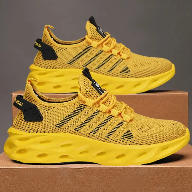 Pair of yellow Simples Market unisex running sneakers with breathable knit mesh and black heel tabs