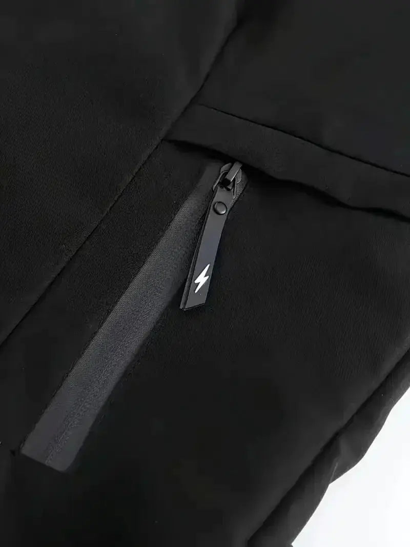 Men's black zip-up windbreaker jacket with lightning bolt zipper pull