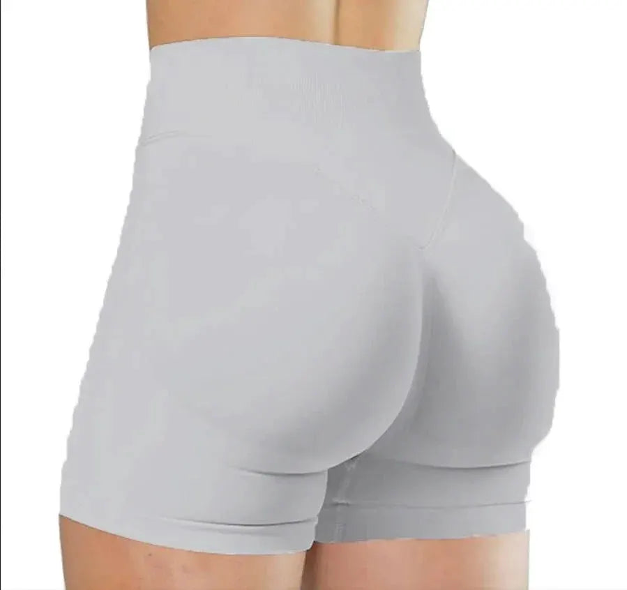 Women's seamless high-waist athletic shorts in light gray for yoga, training and running