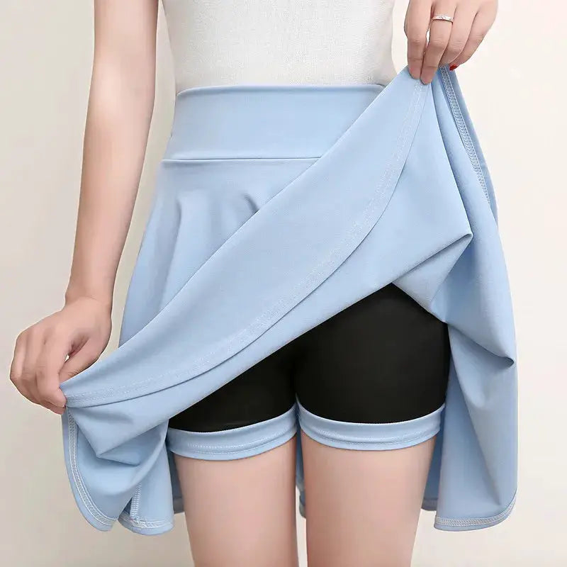 Light blue flared shorts-skirt with built-in black shorts, casual mini skater style.