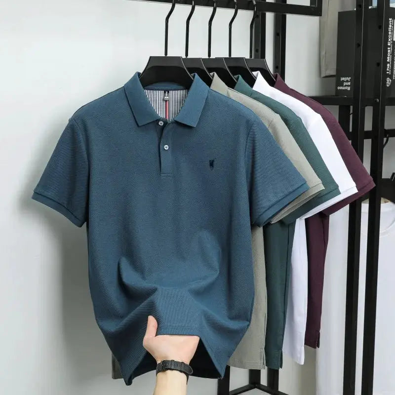Simples Market men's polo shirts on hangers; blue front polo, 100% cotton, small embroidery, multiple colors behind